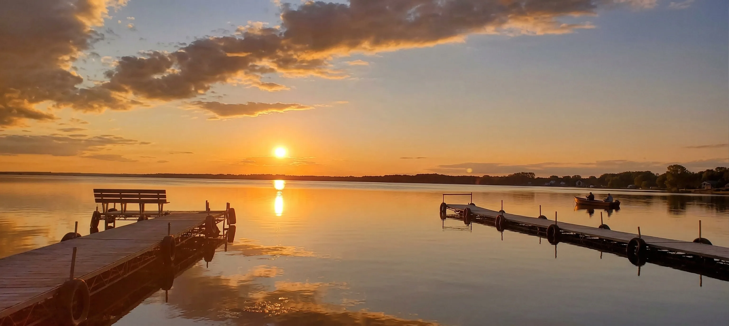 Lawn care and seasonal cleanup crew working on a lakeshore property in Cecil, WI