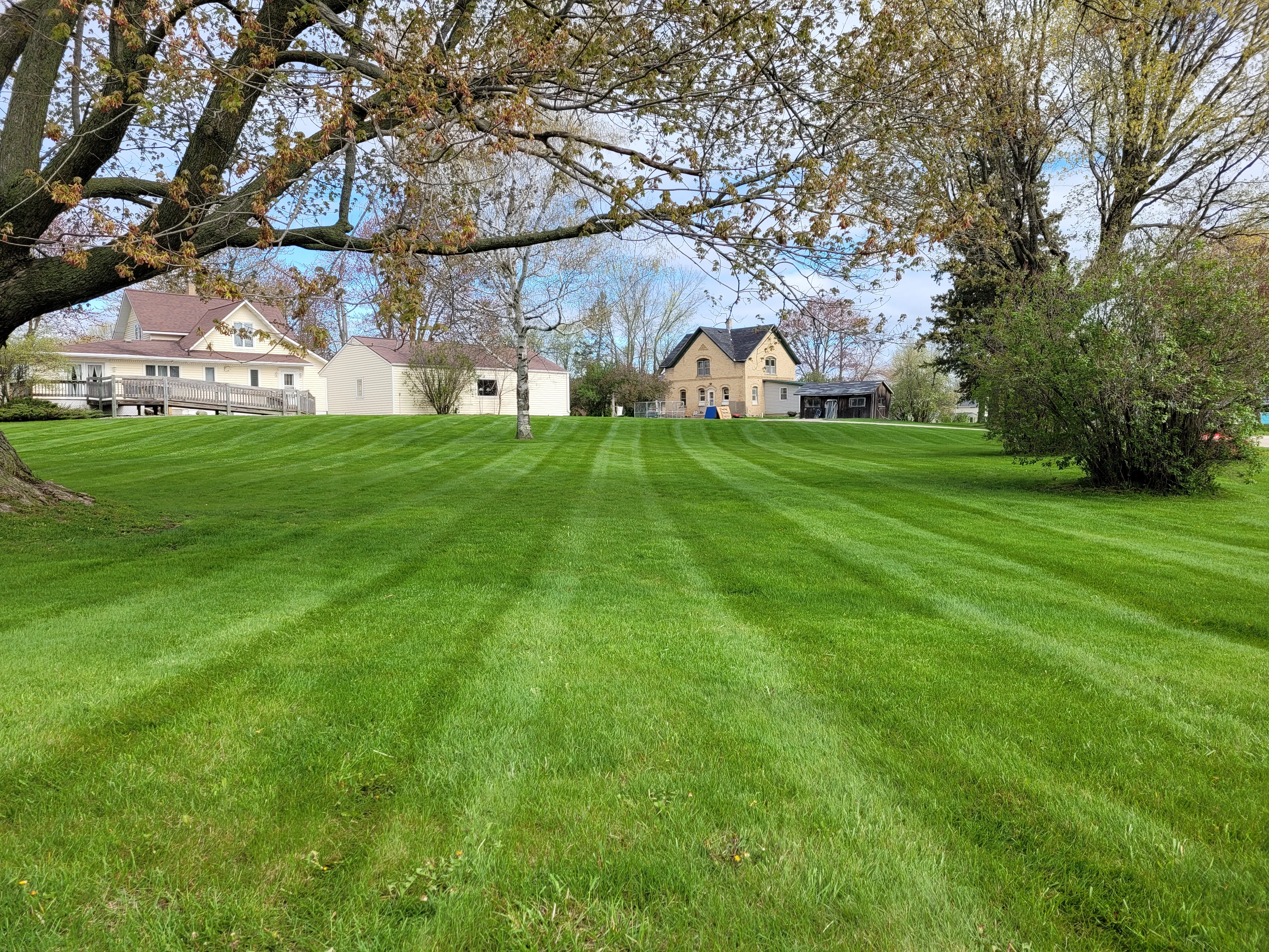 Professional lawn mowing service Shawano WI - Advanced Green Lawn Services real job photo