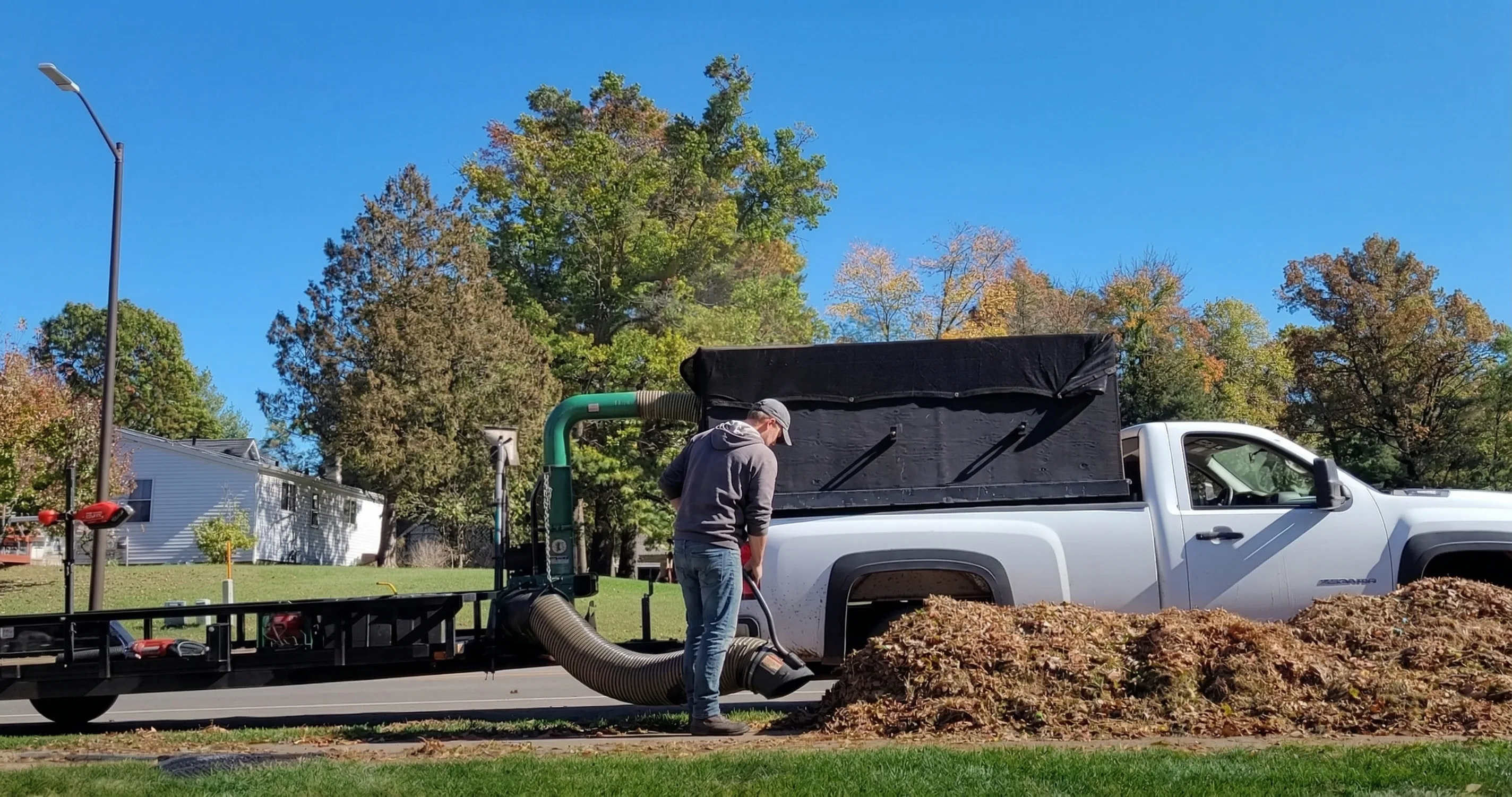 Leaf pickup and removal service Shawano County WI - Advanced Green Lawn Services crew